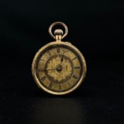 An 18k gold ladies fob pocket watch having an all-over engraved scrolling foliate case surrounding