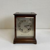 An early 20th century mahogany library or mantle clock by Winterhalder and Hofmeier having a