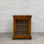A Victorian walnut pier cabinet having a rectangular thumb moulded top and marquetry inlaid frieze
