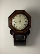 A 19th century rosewood and brass inlaid octagonal drop-dial wall clock having a hand painted dial