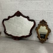 Two contemporary French style wall mirrors to include one with a shaped plate in carved scrolling