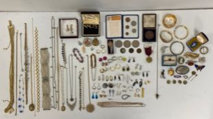A large mixed collection of jewellery to include necklaces, brooches, earrings, cufflinks and