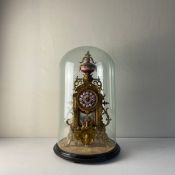 A large 19th century French gilt metal mantle clock in the Rococo style having a hand painted