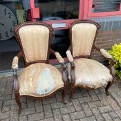 A pair of late 19th century walnut framed armchairs. (In need of re-upholstery).