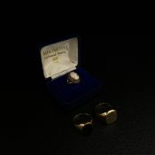 Three 9ct gold rings to include a carved cameo ring, an engraved signet ring and a black onyx signet