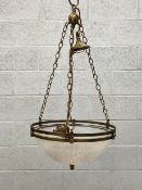An early 20th century Art Deco plafonnier pendant light having a brass openwork surround suspended