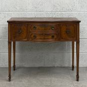 A small Georgian style mahogany sideboard or serving table with fitted drawers containing a complete