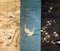 Three 19th century and later Japanese silk embroideries depicting birds among foliage. L.137 W.56cm