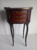 A contemporary Louis XV style mahogany side table having an oval marquetry inlaid top with a brass