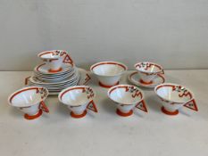 A 20th century Art Deco tea service by Shelley England comprised of six tea cups and saucers, six
