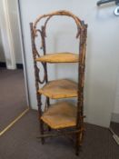 An early 20th century bamboo three-tier whatnot or cakestand. H.92cm