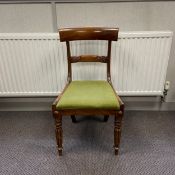 A Regency style mahogany bar back dining chair having a shaped top rail and carved splat with a