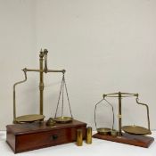 Two pairs of brass balance scales bearing ivorine S. Maw, Son & Sons maker's plaques raised on