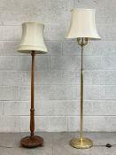 A vintage mahogany standard lamp having a carved leaf finial on a fluted and carved acanthus leaf