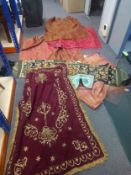 A mixed collection of Arabic and other embroidered textiles. Largest 120x80cm.
