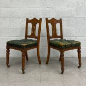 A pair of late 19th century oak Aesthetic style hall chairs in deep buttoned leather upholstery. H.