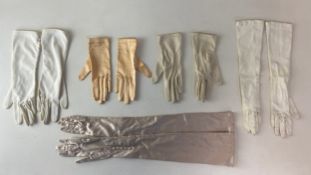 Five pairs of ladies satin gloves. L.54.5cm