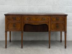 A Georgian style mahogany serpentine fronted sideboard fitted with canteen drawer with cutlery. H.