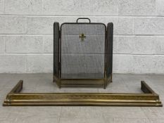 An early 20th century iron meshwork fireguard with an applied Fleur de Lys crest raised on a brass