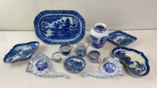 A miscellaneous collection of blue and white ceramics. L.39.5cm
