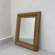 A C.1900 wall hanging mirror having a rectangular plate in a simple ash frame. H.94 W.66cm