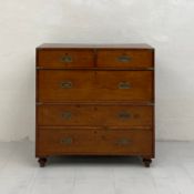 An early 19th century brass bound teak campaign chest in two parts having a rectangular top over