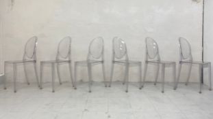 A set of six clear shock and weatherproof polycarbonate Louis Ghost dining chairs designed by