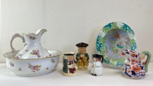 A mixed collection of ceramics to include a large Limoges jug and basin, three vintage Toby jugs