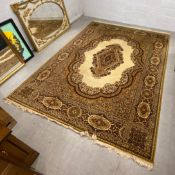 A large Keshan style carpet having a central medallion lozenge in a lobed cartouche over a biscuit