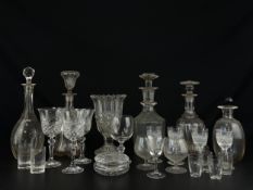 A mixed collection of cut and blown glass to include five decanters, a centrepiece vase and other