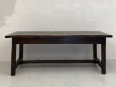 A 19th century oak refectory style dining table having a thick rectangular plank top over a single