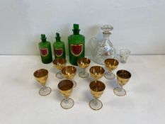 A mixed collection of glass to include three C.1900 reeded green glass apothecary jars with hand