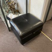 A contemporary black leather footstool with hinged lid and storage compartment. H.43 W.62 D.57cm
