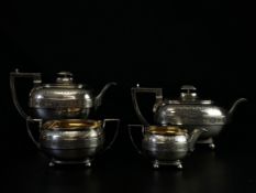 A London 1809 hallmarked silver tea and coffee set to include a teapot, coffee pot, creamer and twin