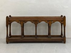 A large late 19th century oak Gothic revival umbrella stand having a moulded open top with gridded