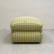 A vintage footstool on castors of square form in a green gingham upholstery bound in the middle with