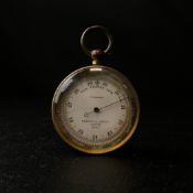 An early 20th century Negretti & Zambra compensated pocket barometer model 12353 with a brass
