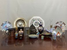 A mixed collection of Oriental and other items to include a miniature cloisonne vase on a hardwood