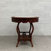 A 20th century Chinese hardwood occasional table having a circular white marble inset top over a