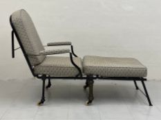 A Victorian metamorphic campaign daybed having a folding wrought iron frame with loose reupholstered