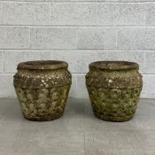 A pair of early 20th century reconstituted stone Cotswold Studio style twin-handled garden urns or