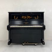 A 20th century C. Bechstein ebonised and marquetry inlaid upright piano. H.124 W. D.cm