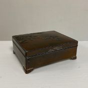 An early 20th century Japanese Meiji period simulated bronze box having a cast cherry blossom