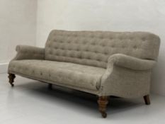 A late 19th century Chesterfield style sofa having a square buttoned back and scrolled arms over a