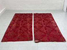 A pair of red silk damask curtains. (With wear as seen). L.234 W.107cm