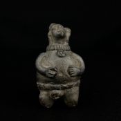 A small south or central American Pre-Columbian carved stone fertility figure. H.10cm
