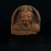 An Indian possibly Gupta period sculpted terracotta figural bust or head depicting a Hindu deity