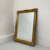 A large 19th century style mirror having a rectangular plate in a moulded giltwood frame. H.97.5 W.