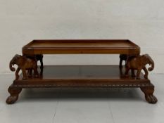 A vintage Anglo-Indian or Southeast Asian hardwood coffee table having a rectangular tray top with