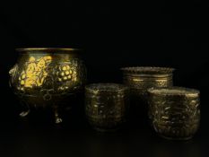 A Victorian brass planter of globular form having an everted rim and a continuous band of grape